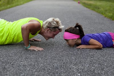 mother and child working out, playing sports